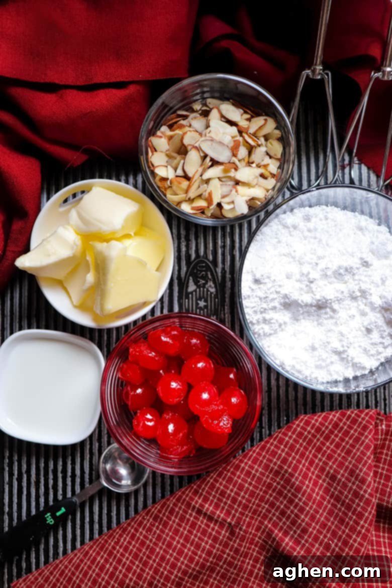 Ingredients for buttercream and topping: butter, maraschino cherries, slivered almonds, powdered sugar, and milk.