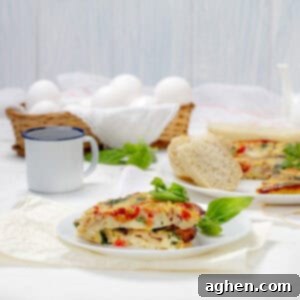 Spinach, Tomato, and Turkey Ham Frittata slices on a plate.