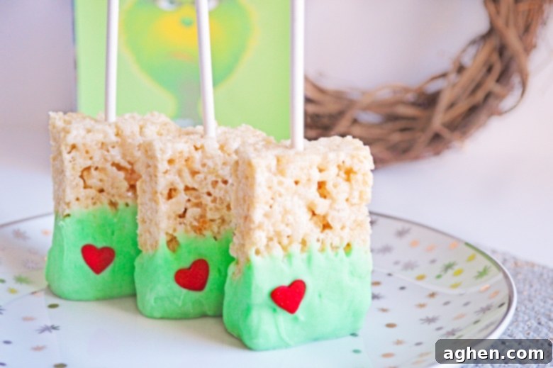 Grinch Rice Krispie Treats for Christmas, green chocolate with red heart