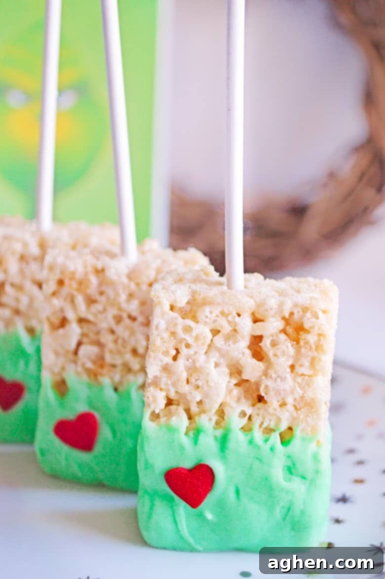 Grinch Rice Krispie Treats arranged on a platter, ready to serve