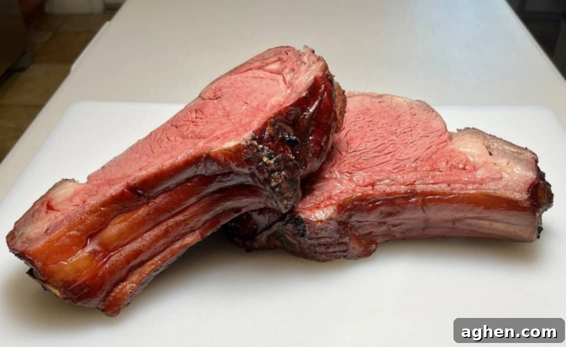 Carved smoked prime rib steaks with bone on the side, ready to serve.