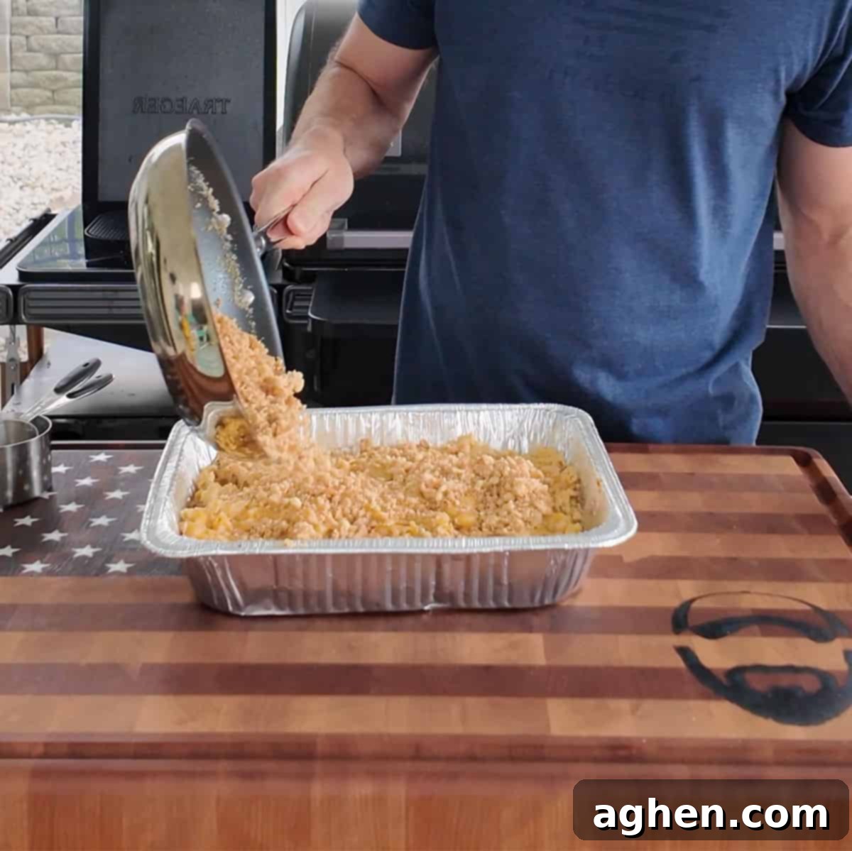 The Definitive Backyard Smoked Mac & Cheese 8 Cracker crust being prepared in a saucepan.