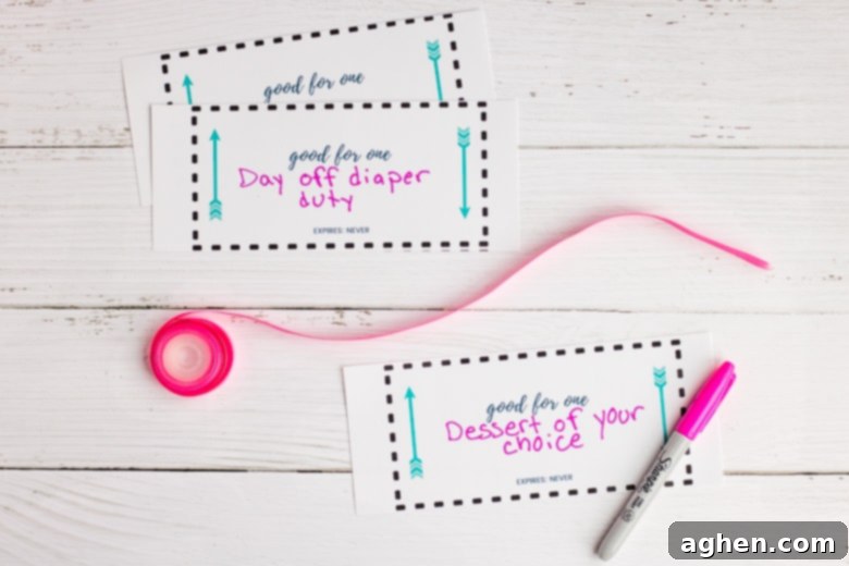 Handwritten love coupons with pink ribbon and marker for personalization