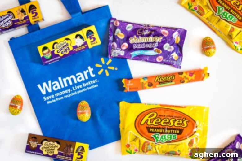 Assorted HERSHEY'S and Cadbury Easter candies, including various eggs and shimmering mini eggs, purchased from Walmart for cake decoration and holiday treats.