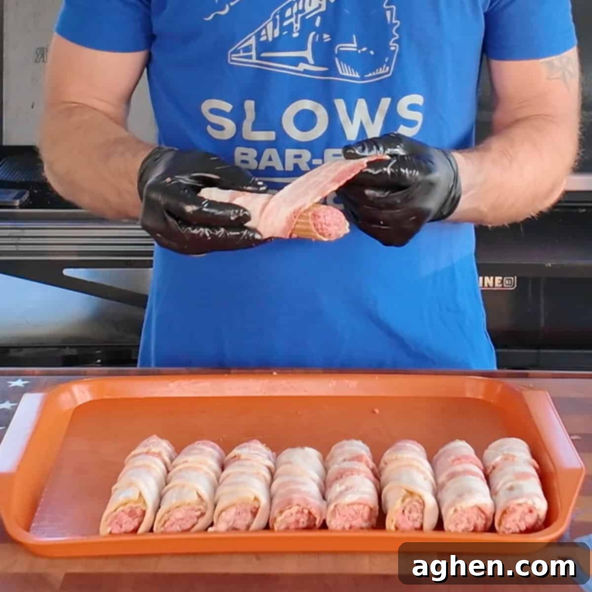Several stuffed manicotti shells individually wrapped in raw bacon strips, ready for refrigeration