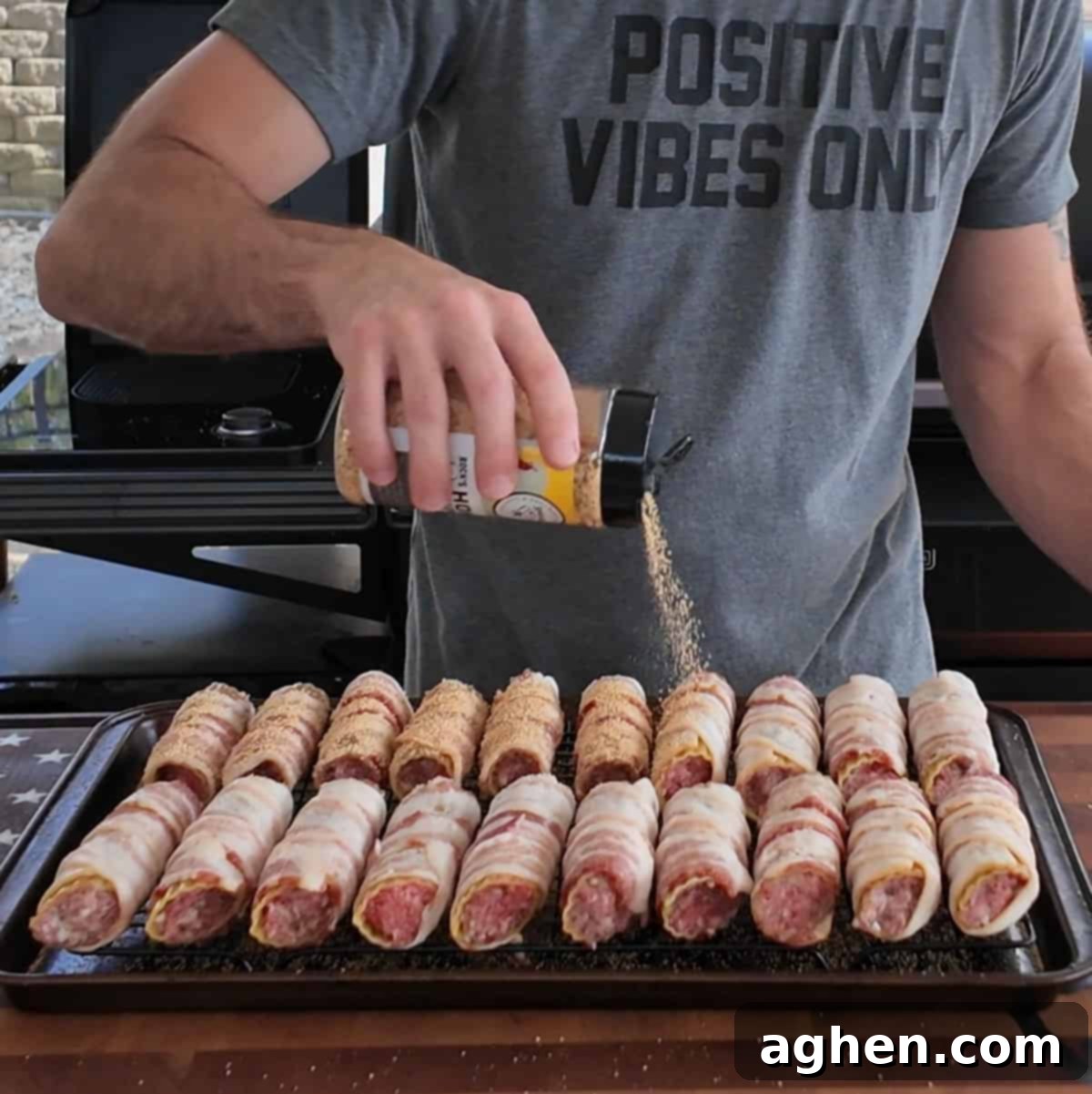 Smoked shotgun shells cooking on a grill rack inside a smoker, looking golden brown