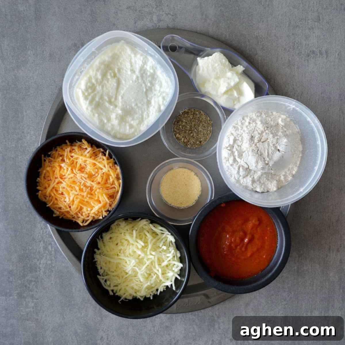 Homemade Weight Watchers Pizza: Why You'll Never Go Back to Store-Bought 3 A selection of ingredients laid out, including flour, Greek yogurt, cheeses, and various fresh vegetables for toppings.