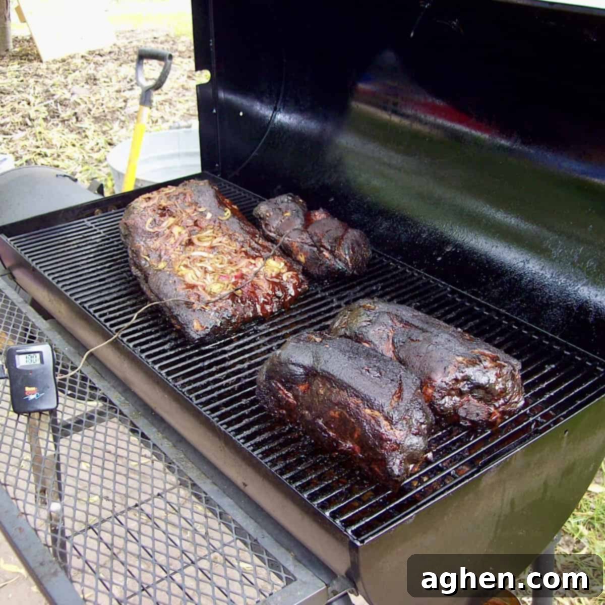 A precise thermometer showing the stable temperature inside a smoker, emphasizing the importance of consistent heat for long cooks.