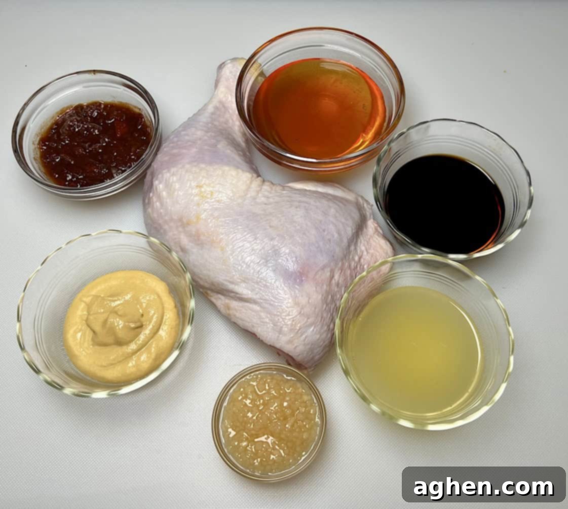 Ingredients for smoked honey glazed chicken, including chicken, glaze ingredients, and a whisk.
