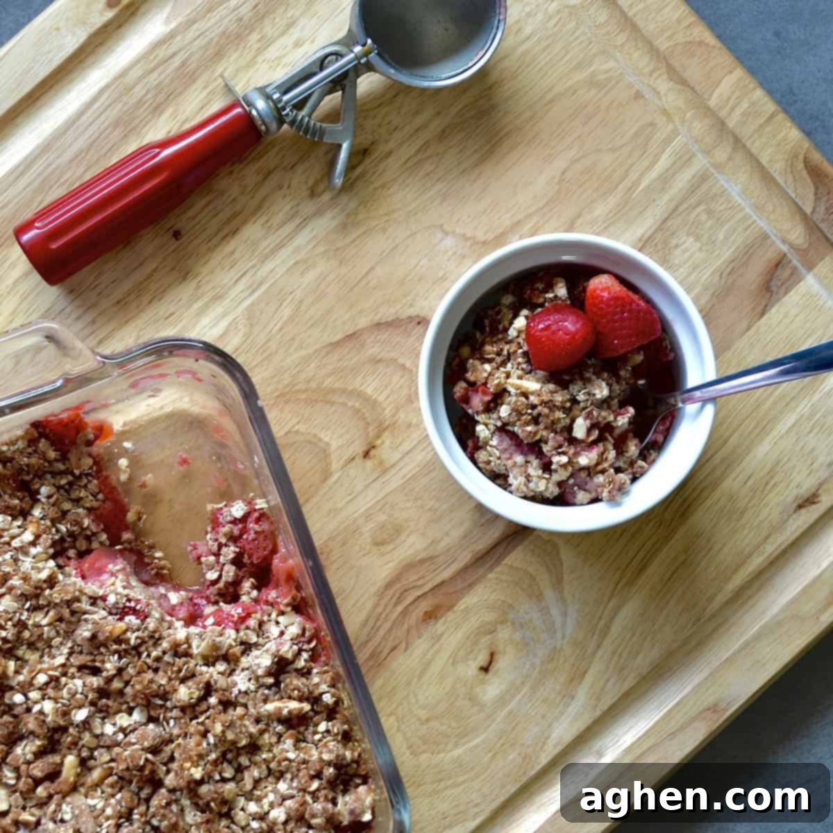 Guilt-Free Strawberry Rhubarb Crisp 6 Close-up of a warm, bubbly Weight Watchers strawberry rhubarb crisp being served, showcasing its golden topping and fruit filling