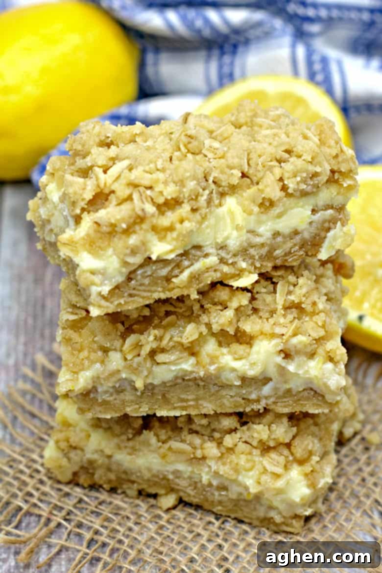 Oatmeal Lemon Creme Bars sliced and ready to serve on a white plate