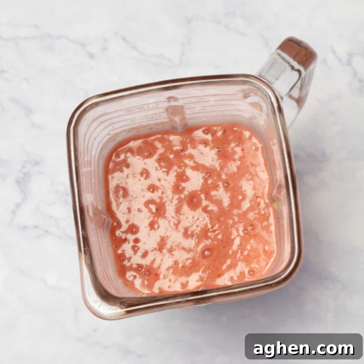 The smooth and creamy blended ice cream base remains in the blender pitcher, perfectly mixed and ready for the next step of freezing.