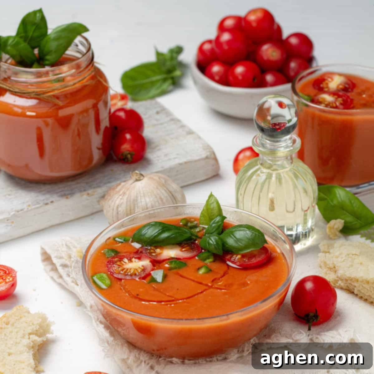 Light and refreshing gazpacho in a bowl topped with fresh garnishes.