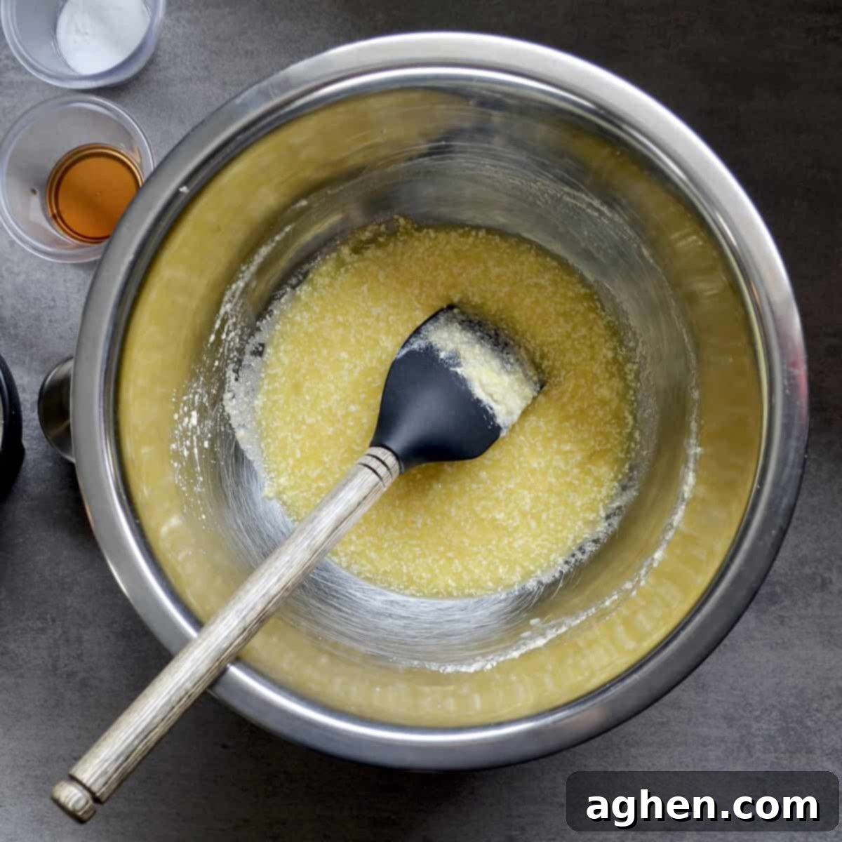 Close-up of homemade chocolate chip cookie dough being mixed in a bowl, showcasing its rich texture before baking.