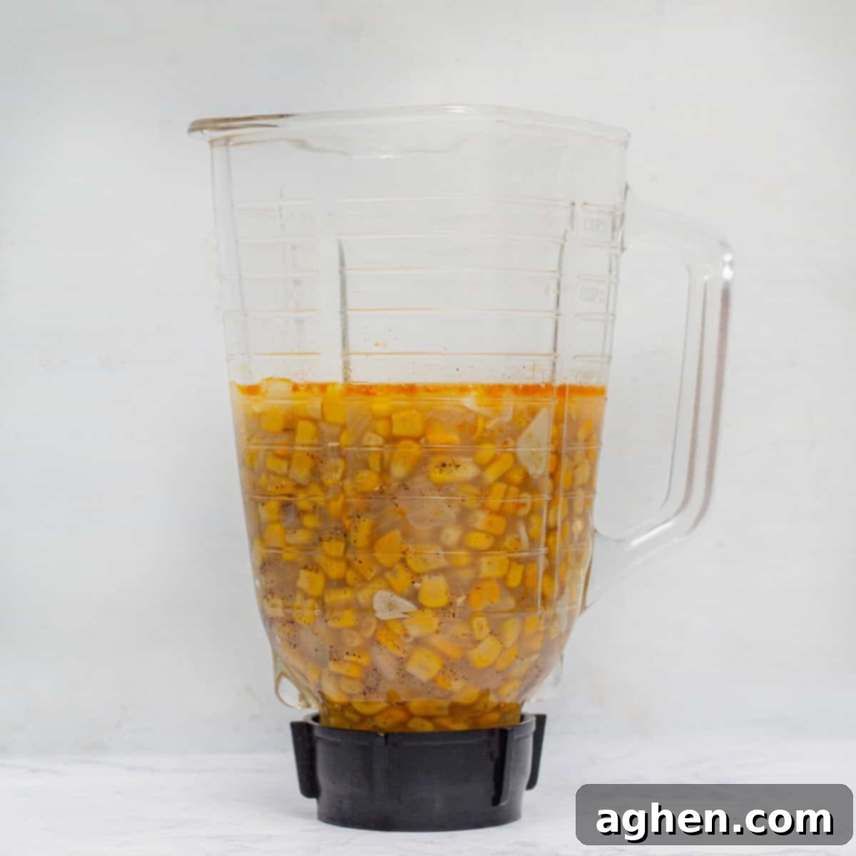 The smoothly blended soup ingredients inside a high-speed blender, showcasing the creamy texture after pureeing.