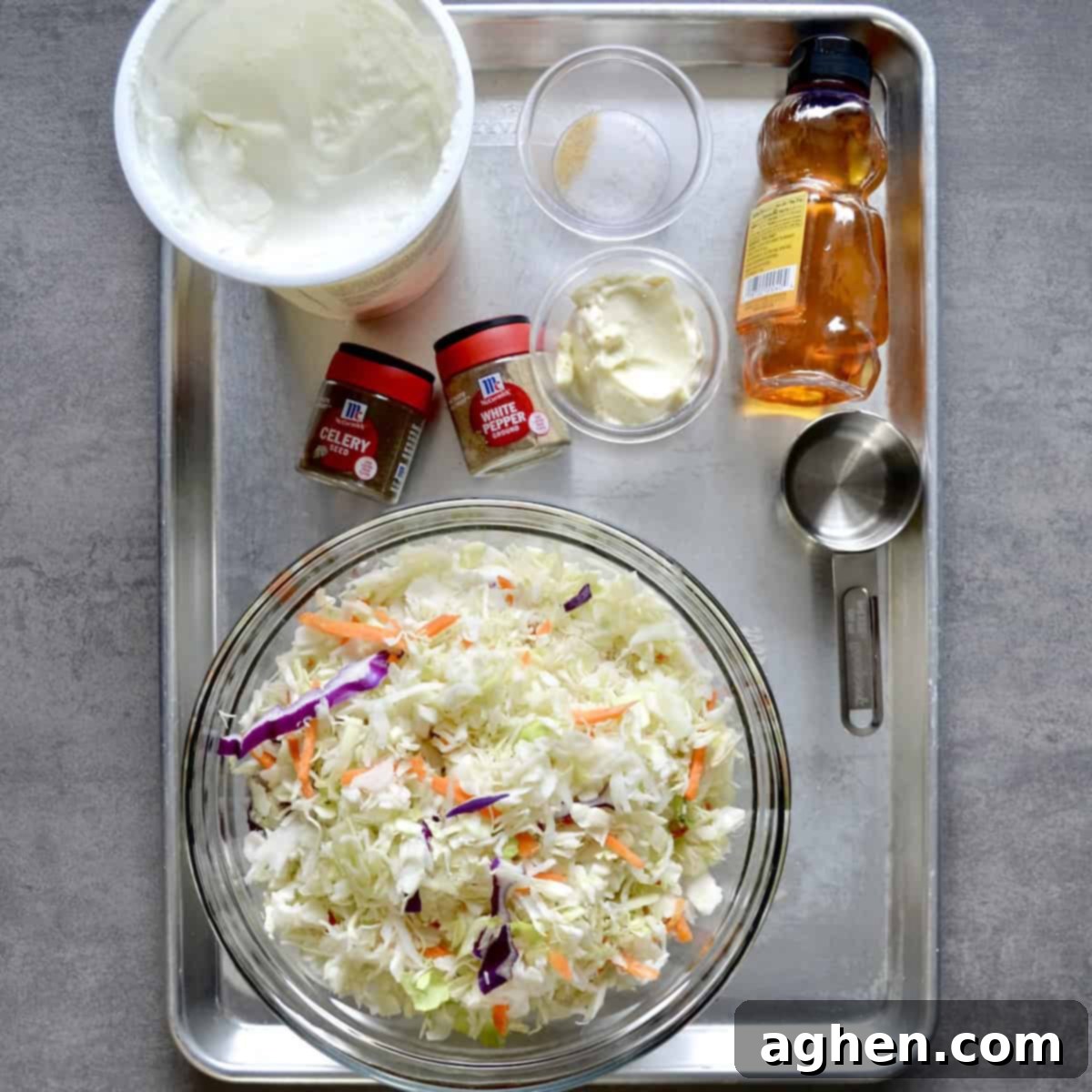 Skinny Creamy Coleslaw 3 Assortment of fresh ingredients for making homemade creamy coleslaw displayed on a kitchen counter