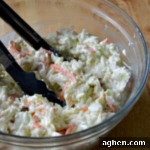 Skinny Creamy Coleslaw 6 Creamy coleslaw with tongs for serving