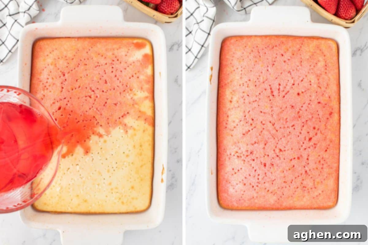 Strawberry jello mixture being poured over the entire top of the cake.