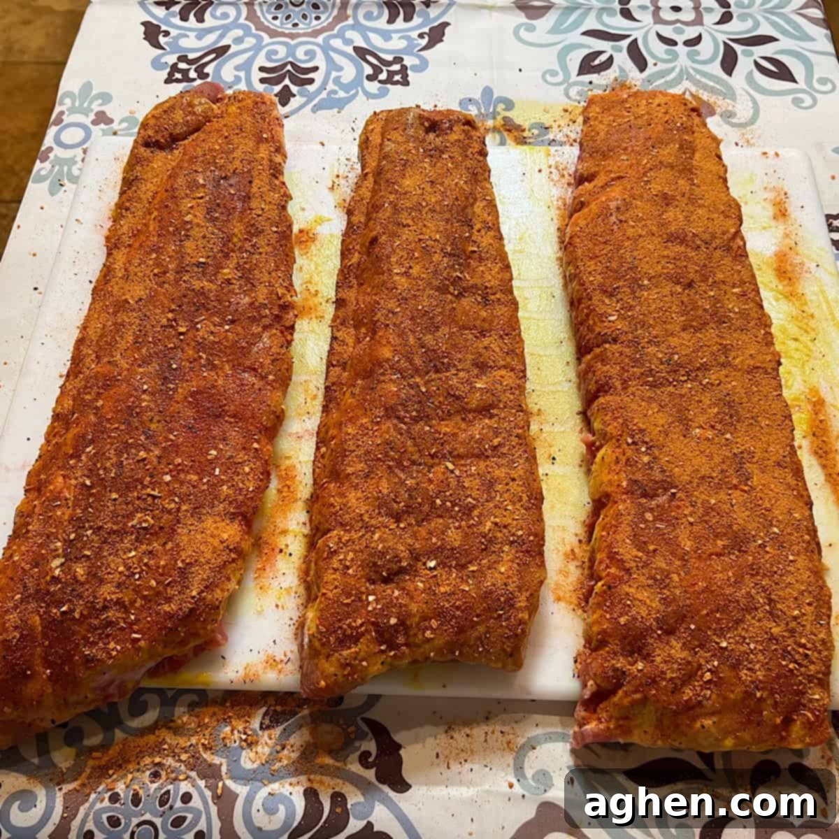 6 Blunders That Will Destroy Your Smoked Baby Back Ribs 8 Close-up of baby back ribs with perfectly applied dry rub.