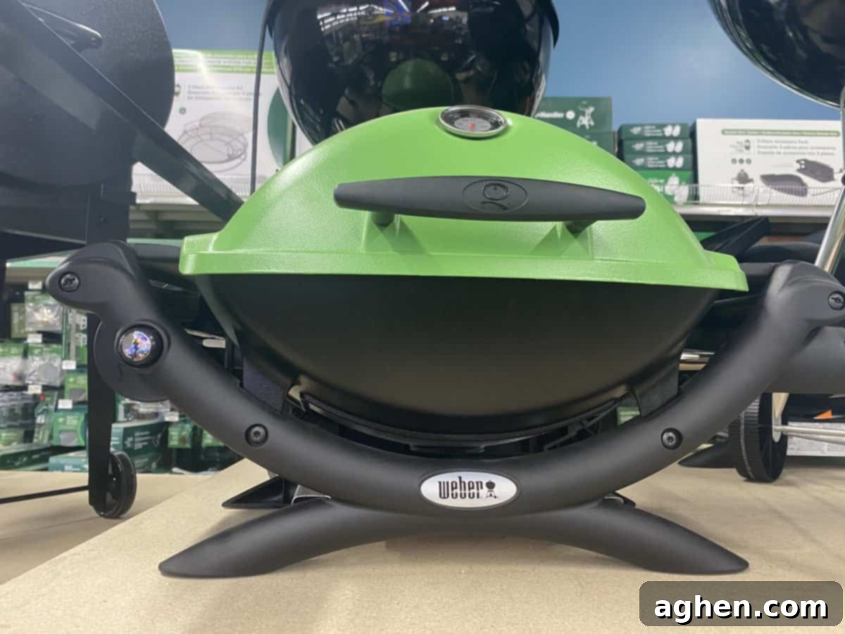Weber Q 1400 Electric Grill in a compact setting, showcasing its portability and small footprint.