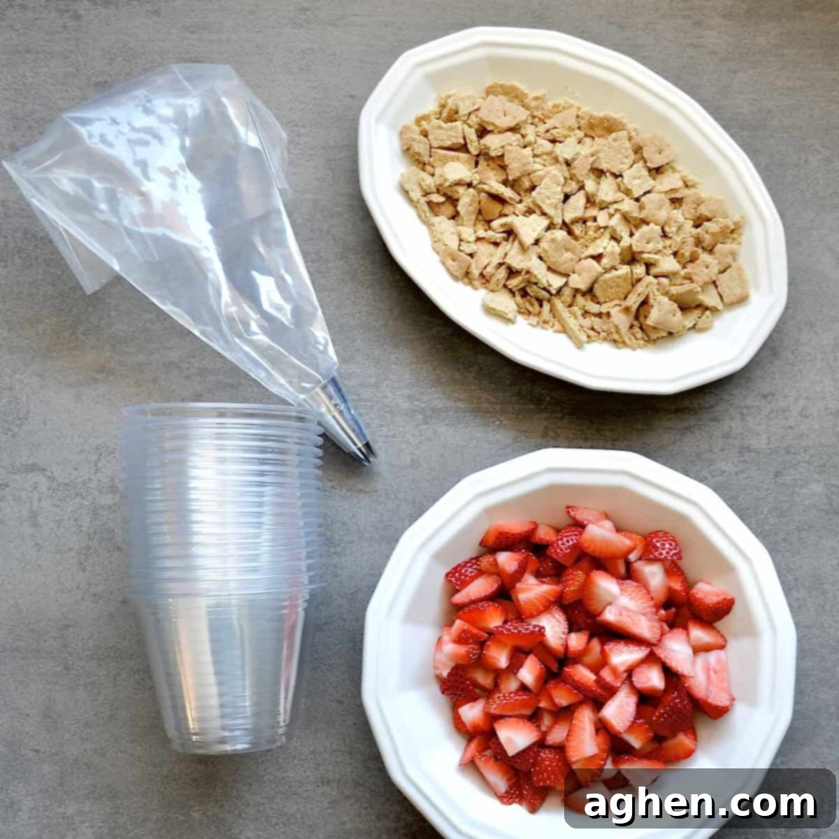 Weight Watchers' Legendary Cheesecake Fluff 4 Freshly chopped strawberries next to a pile of crushed low-fat graham crackers, ready for the cheesecake fluff.