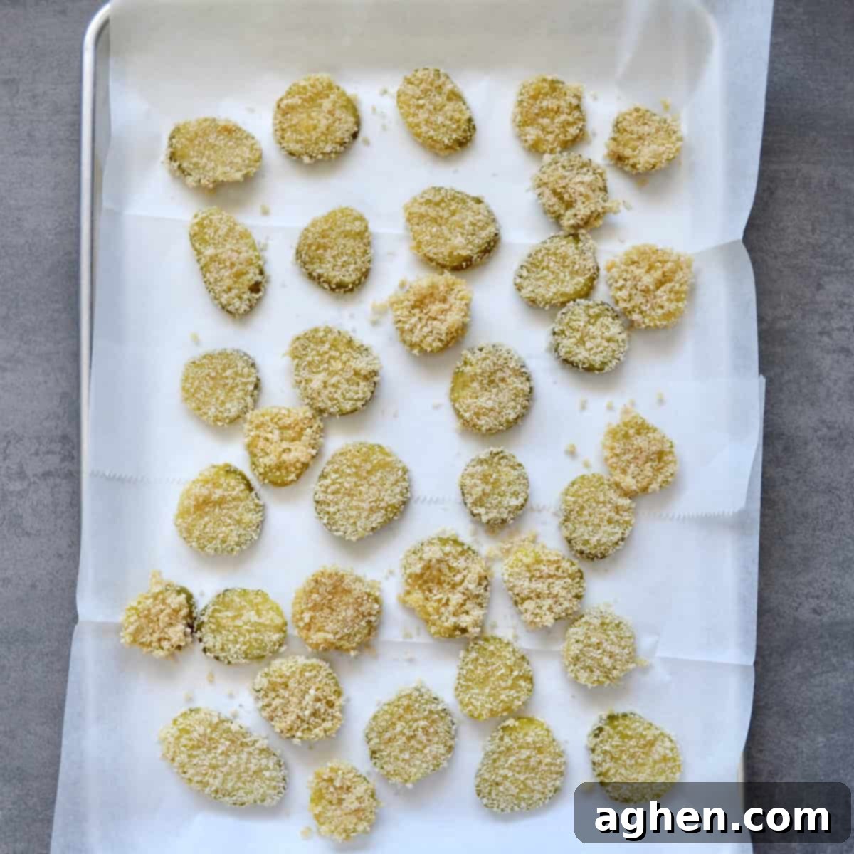 breaded pickles on a sheet pan