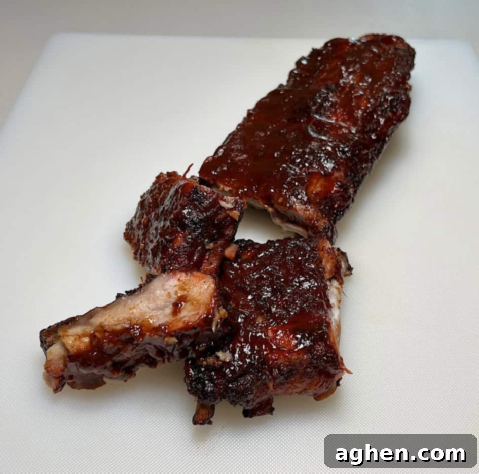 Perfectly smoked baby back ribs fresh off the Weber Kettle