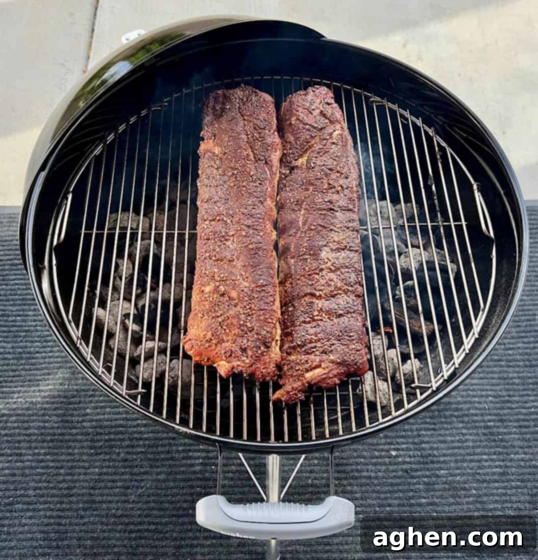 Smoking baby back ribs on Weber Kettle for final glaze