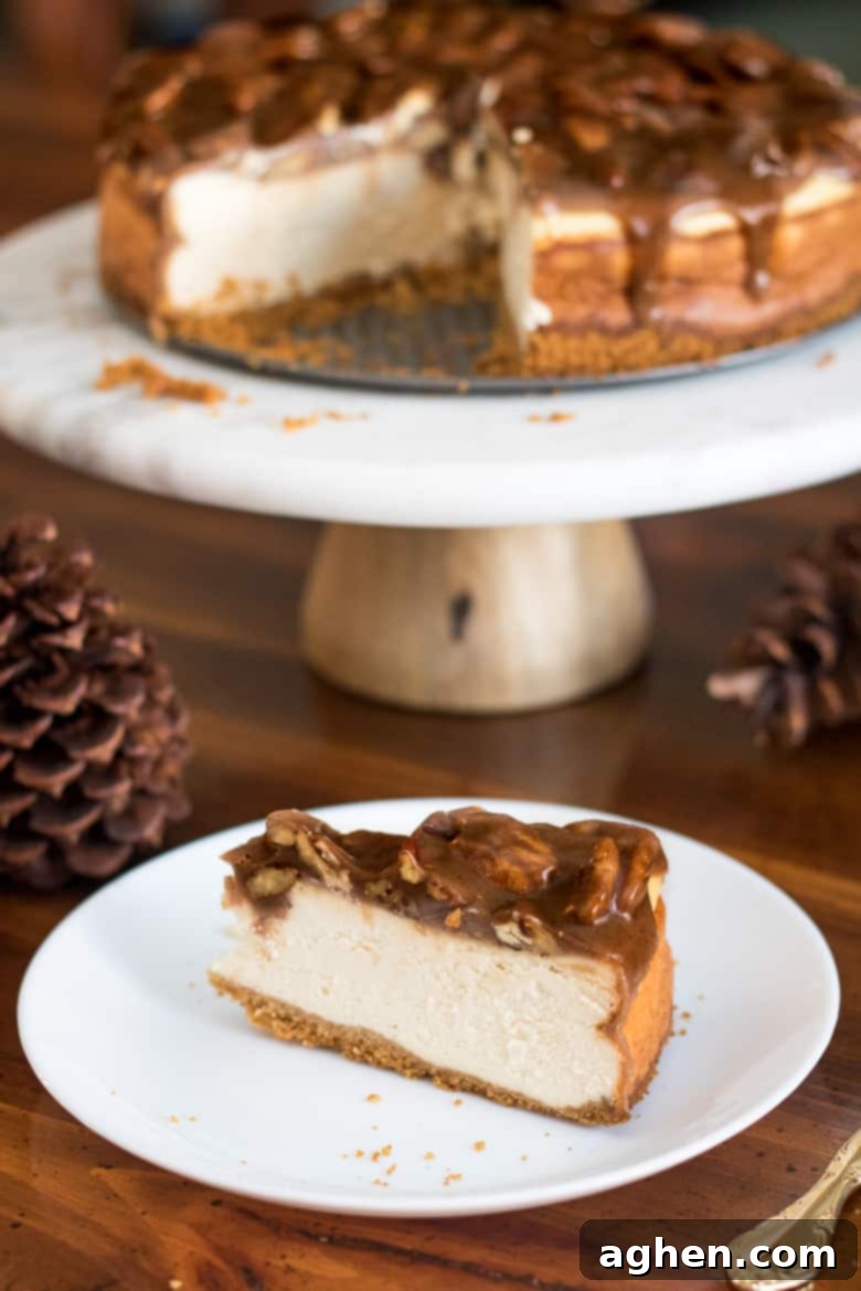 A stunning homemade Pecan Pie Cheesecake, ready to be served, showcasing its golden pecan topping and smooth cream cheese layer.