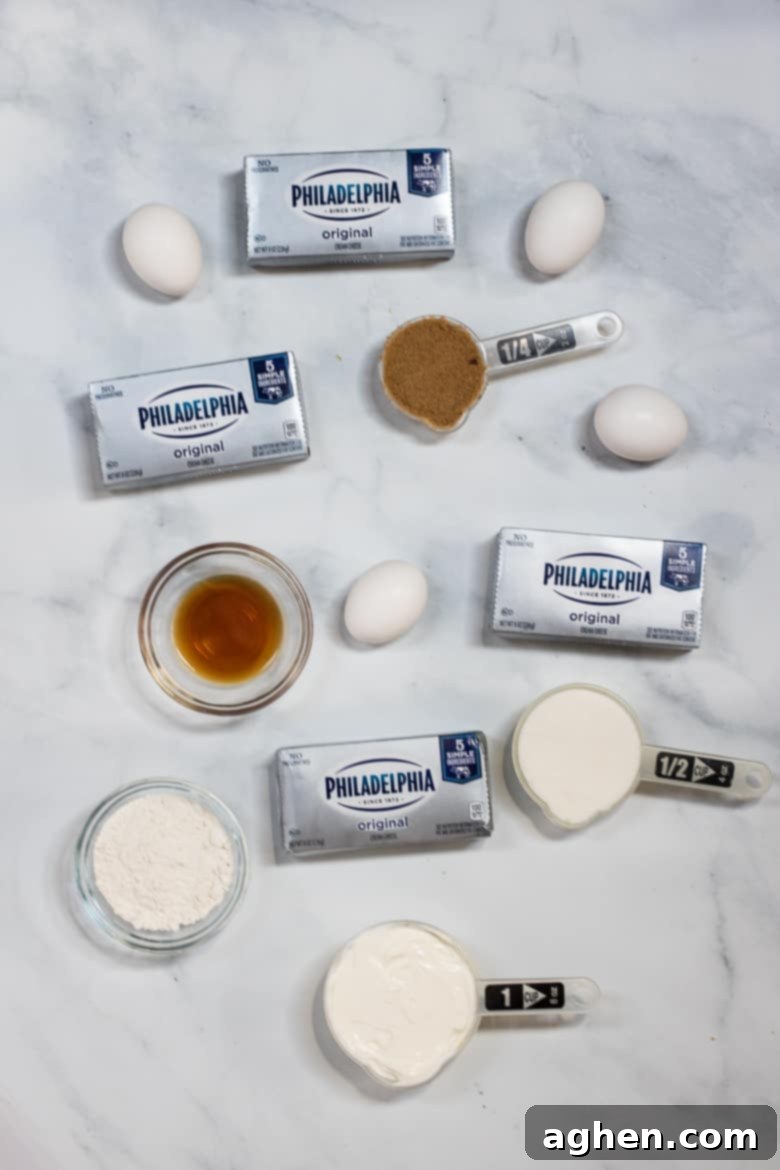 Key ingredients for the cheesecake filling: softened Philadelphia Cream Cheese blocks, eggs, sour cream, and sugars.