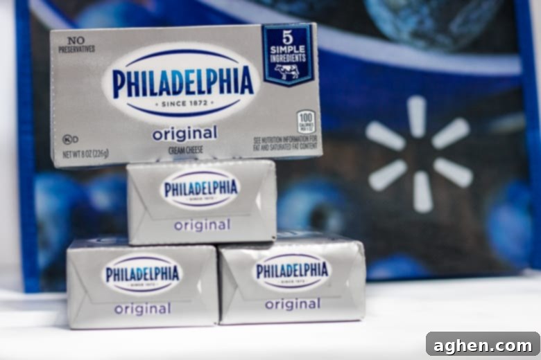 Several packages of Philadelphia Cream Cheese displayed, emphasizing its availability and quality for baking.