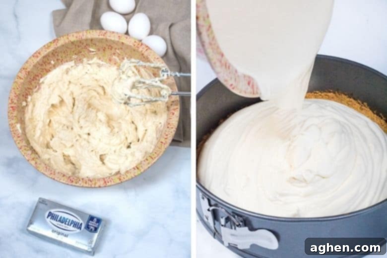 A mixer blending the creamy cheesecake batter in a large bowl, showing the smooth, light texture.