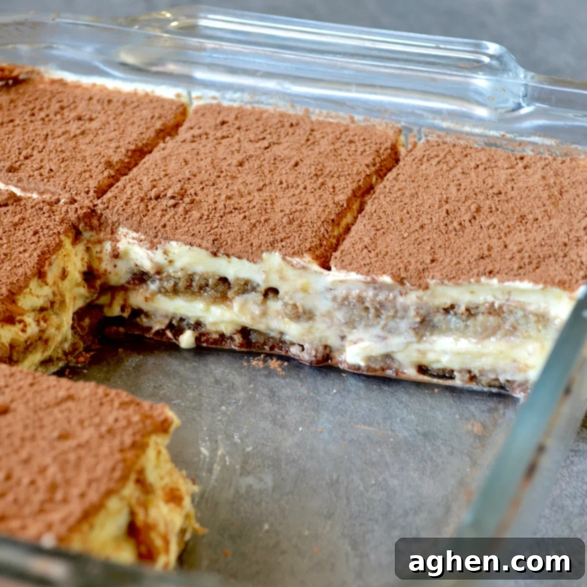 My New Obsession: The Weight Watchers Tiramisu I've Made 3 Weeks Running 7 Freshly sliced tiramisu cake with a rich cocoa dusting, ready to be enjoyed