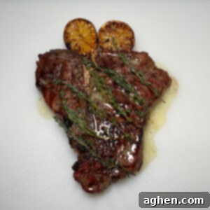 Master The Perfect Grilled Porterhouse Steak 14 A beautifully grilled porterhouse steak with vibrant char marks, ready to be served.