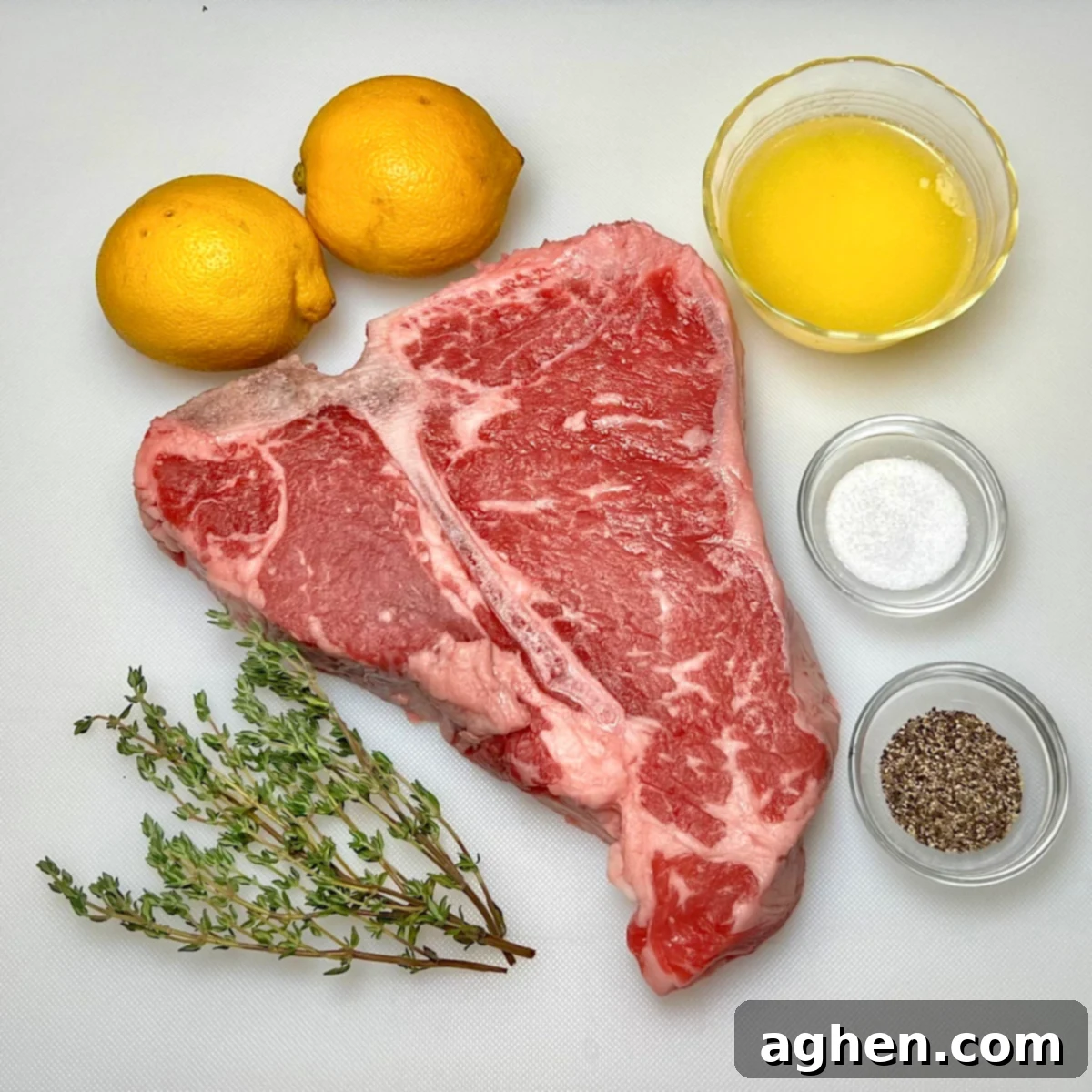 Master The Perfect Grilled Porterhouse Steak 3 Ingredients for grilled porterhouse steak laid out: steak, butter, lemons, thyme, salt, pepper