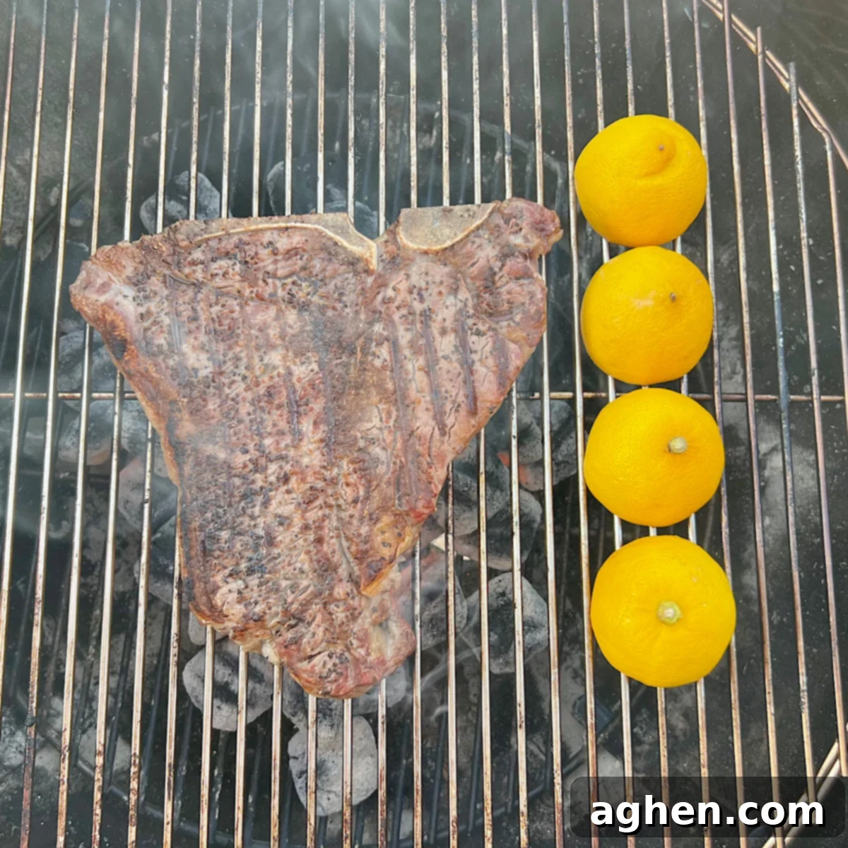 Master The Perfect Grilled Porterhouse Steak 7 Porterhouse steak grilling on a Weber Kettle with lemon halves charring alongside