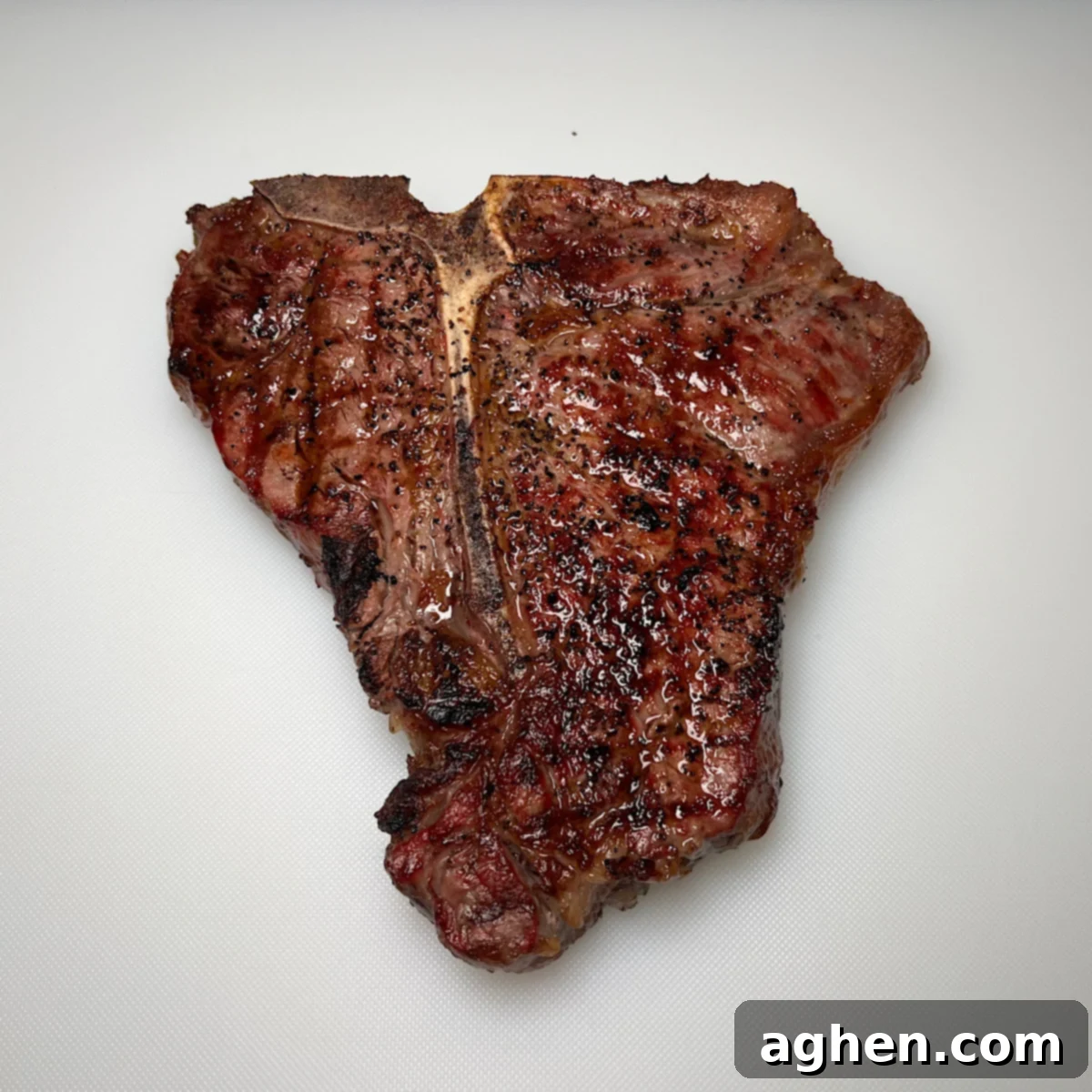 Master The Perfect Grilled Porterhouse Steak 9 Freshly grilled porterhouse steak resting on a plate