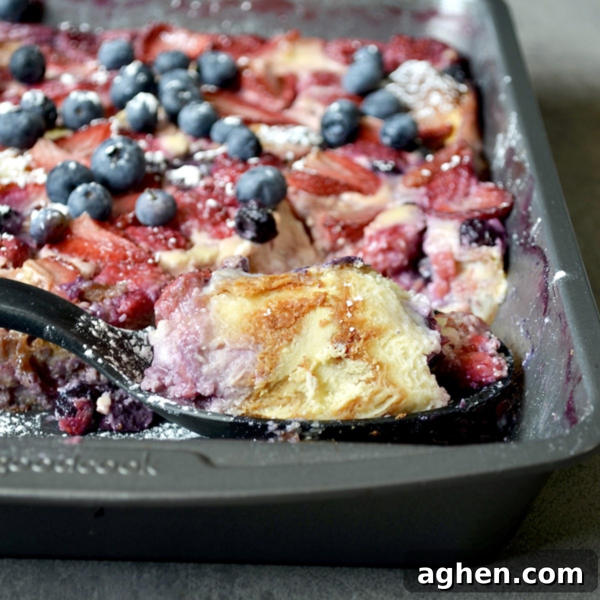 Scoop of breakfast casserole with berries
