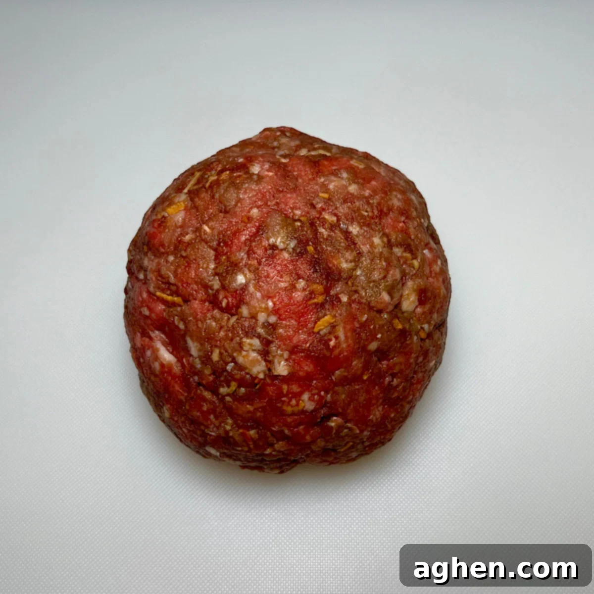 Large meatball for a Juicy Lucy burger before being divided