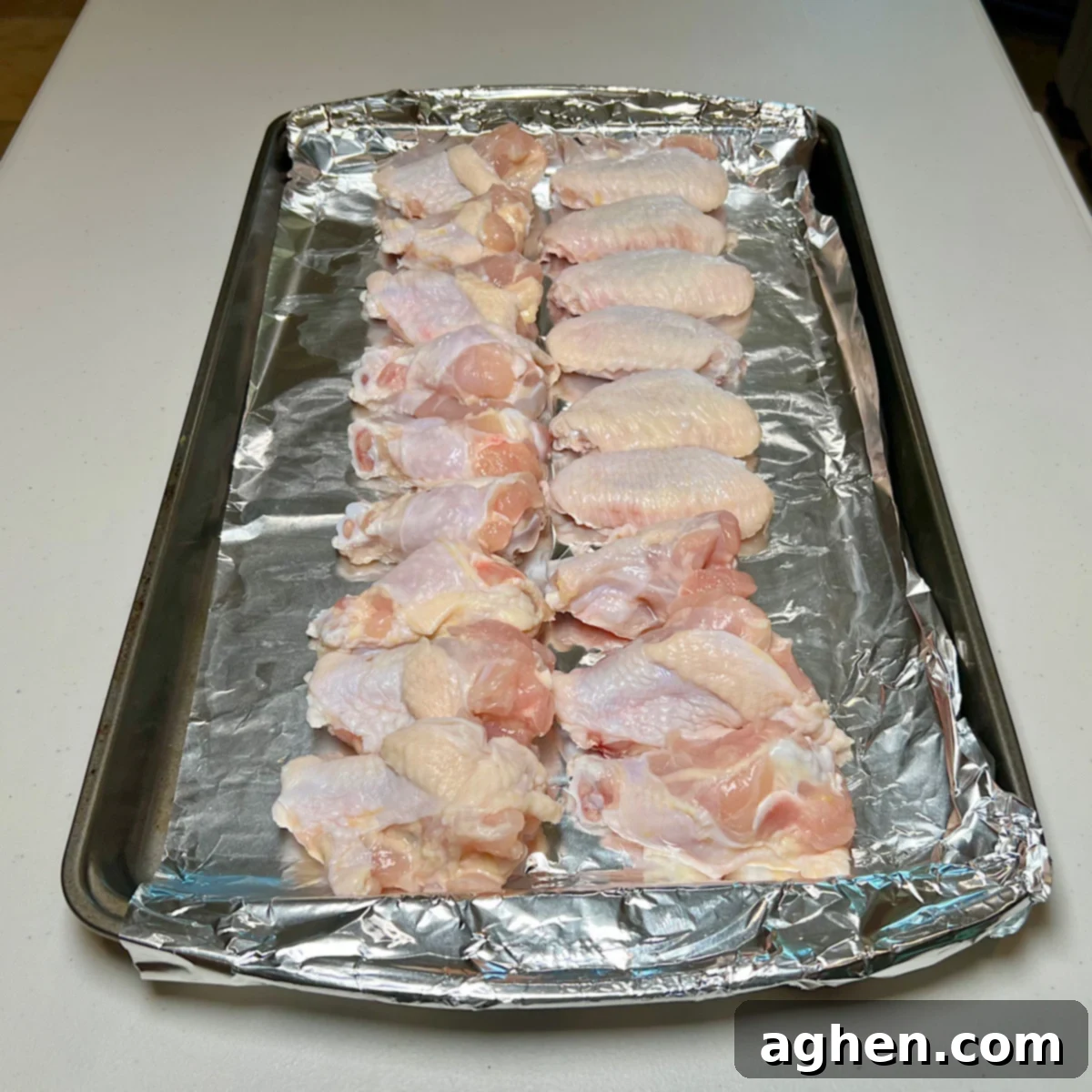 Raw chicken wings on a tray
