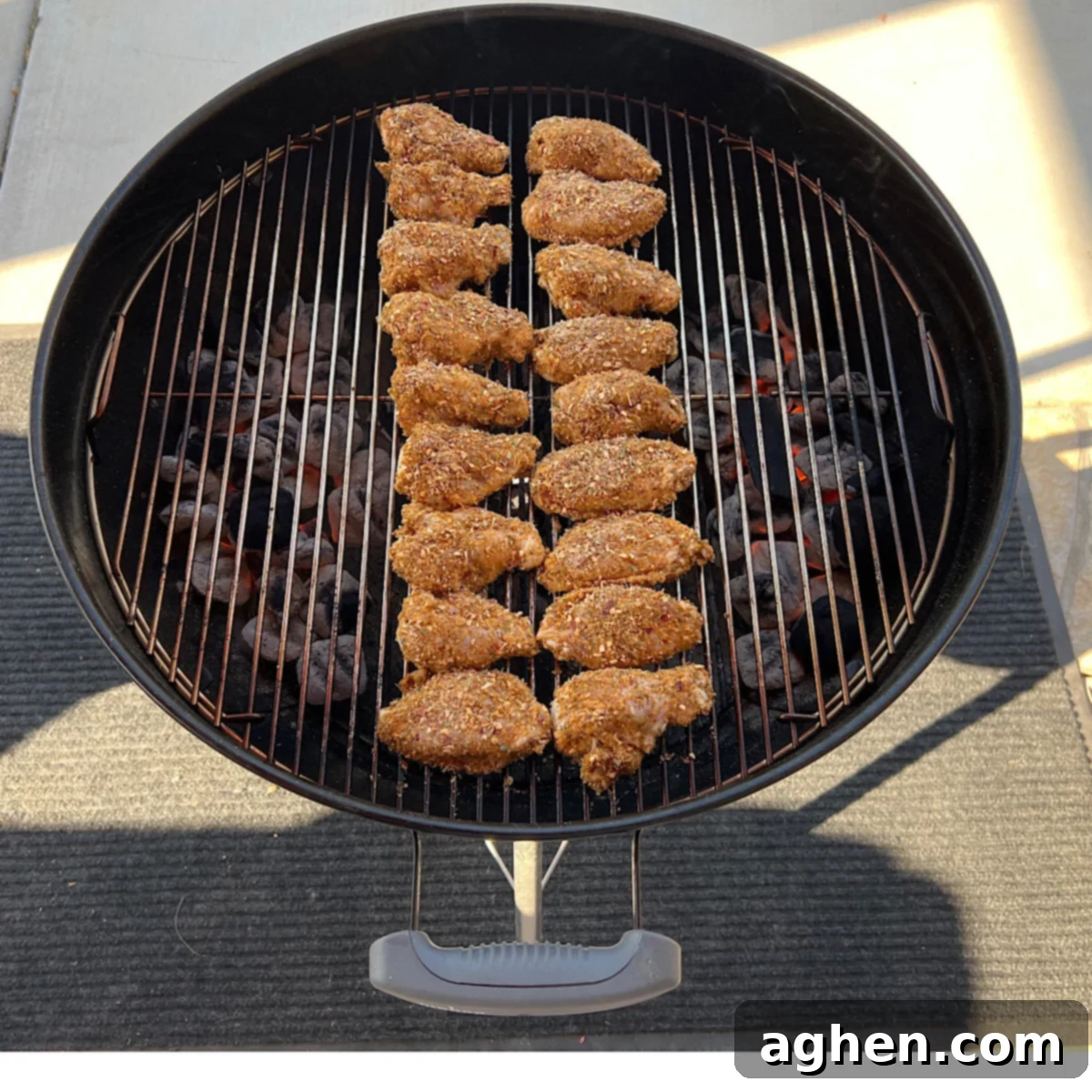 Chicken wings on grill grate over indirect heat