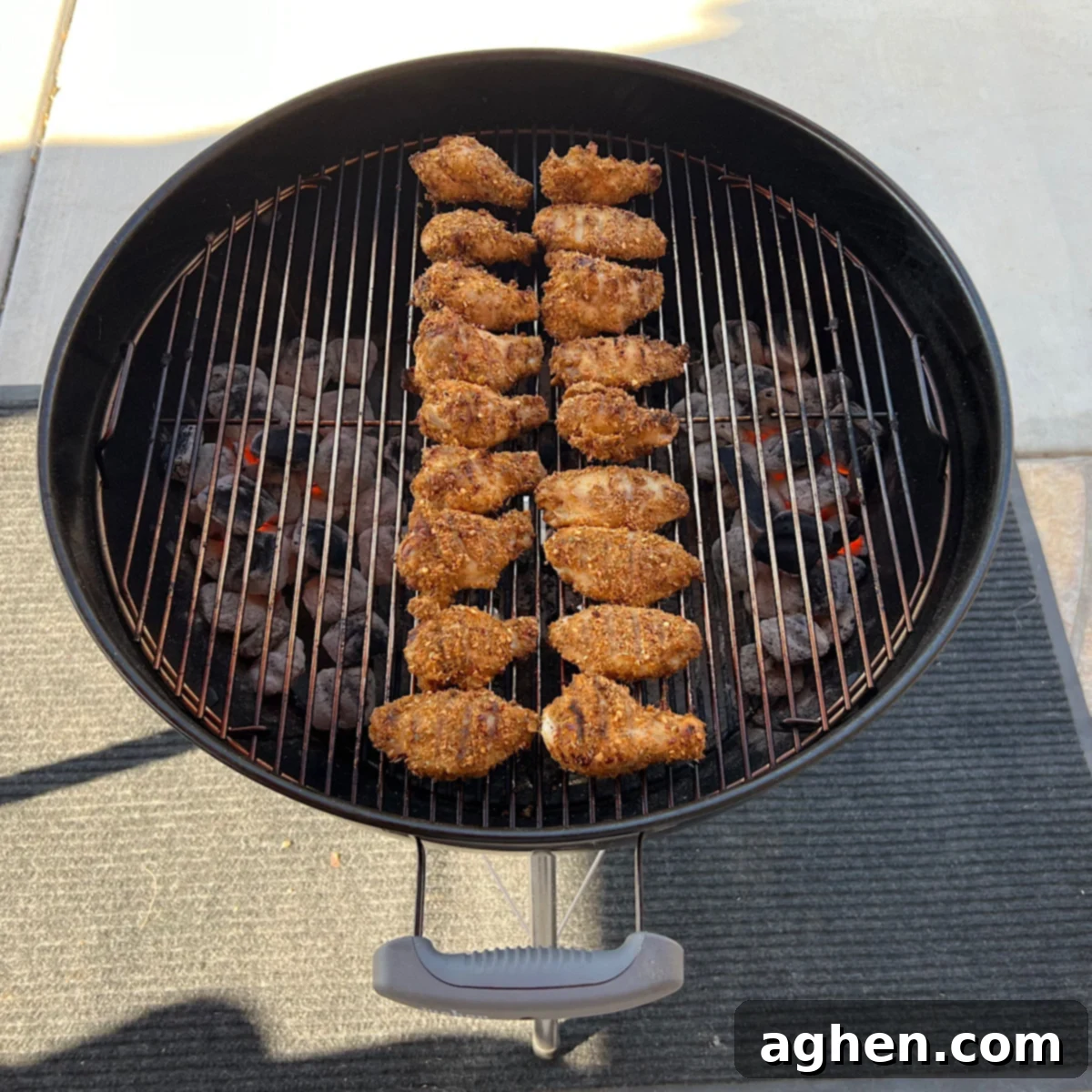Chicken wings grilling indirectly with lid closed