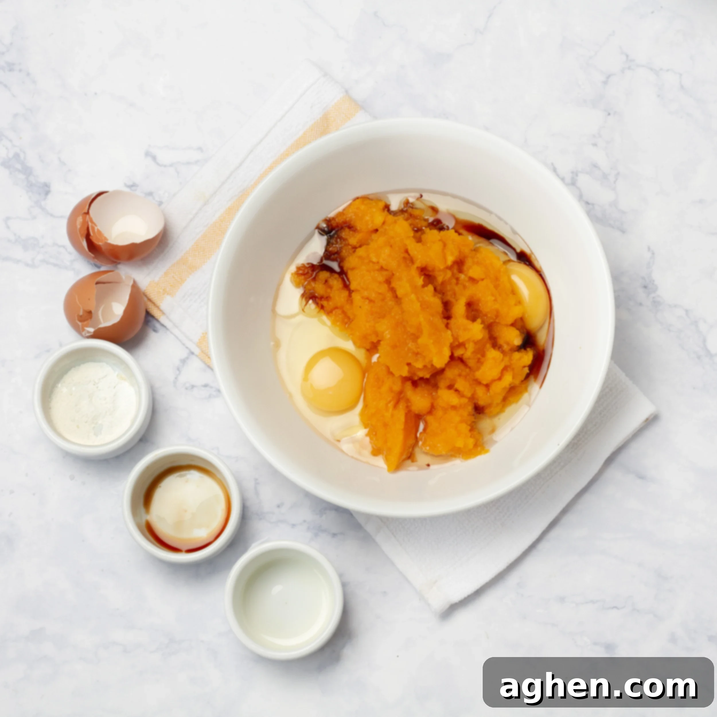 Guilt-Free Spiced Pumpkin Bread 4 All wet ingredients, including vibrant pumpkin puree and fresh eggs, being vigorously whisked together in a clear glass mixing bowl, creating a smooth, inviting orange batter.