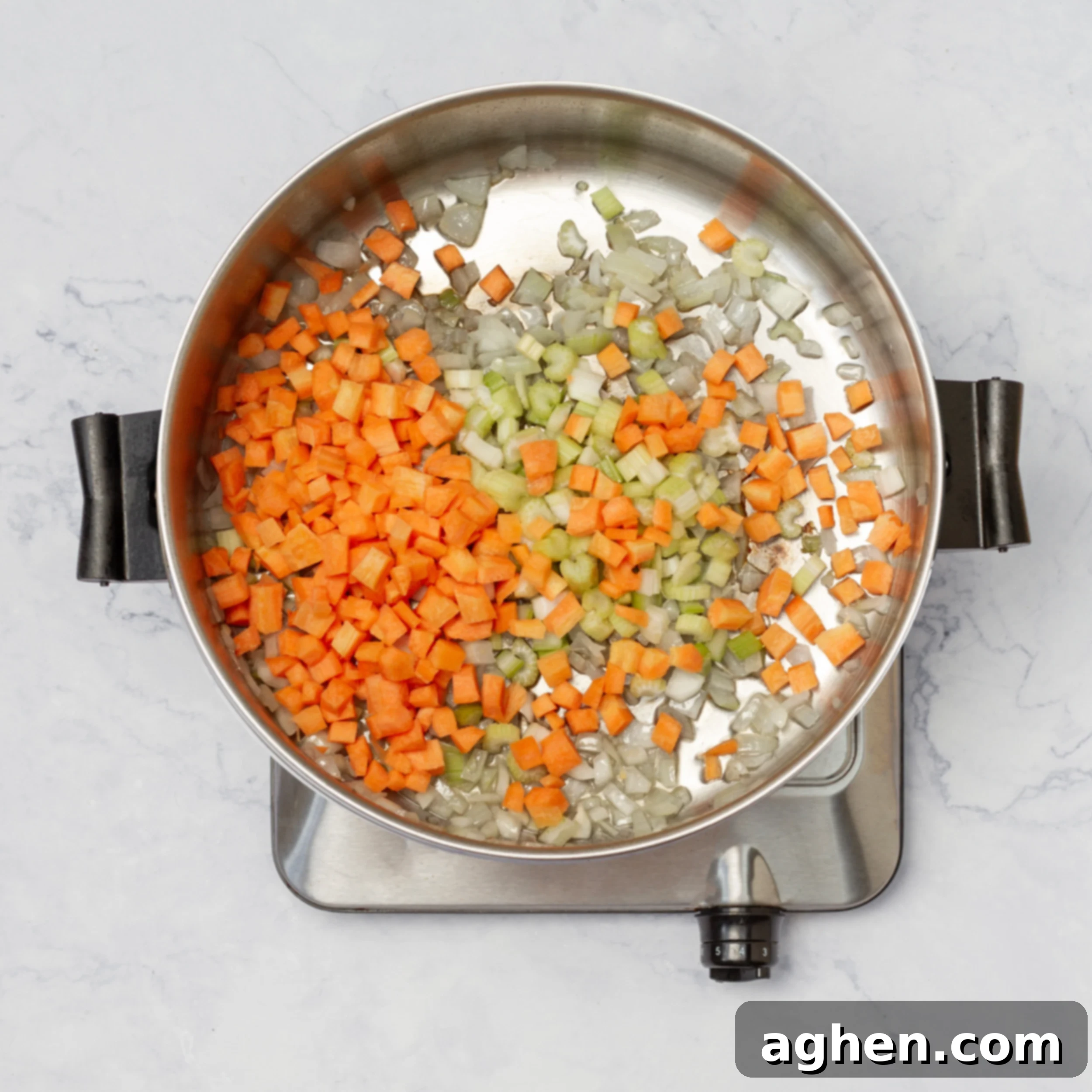 Aromatics sauteing in a soup pot. 