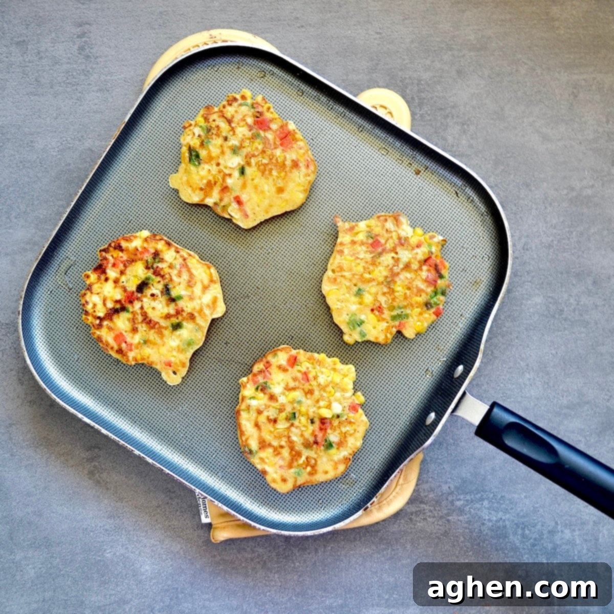 Cooked corn fritters on a skillet