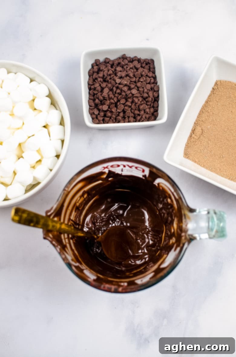 Melted chocolate in a measuring cup, showing smooth, glossy texture.