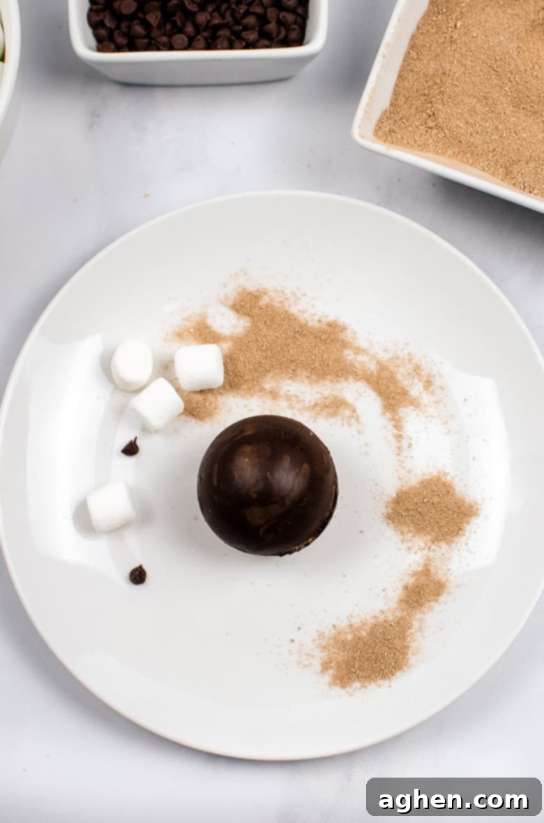 Homemade Hot Chocolate Bomb, showing a filled chocolate dome and an empty one for sealing.