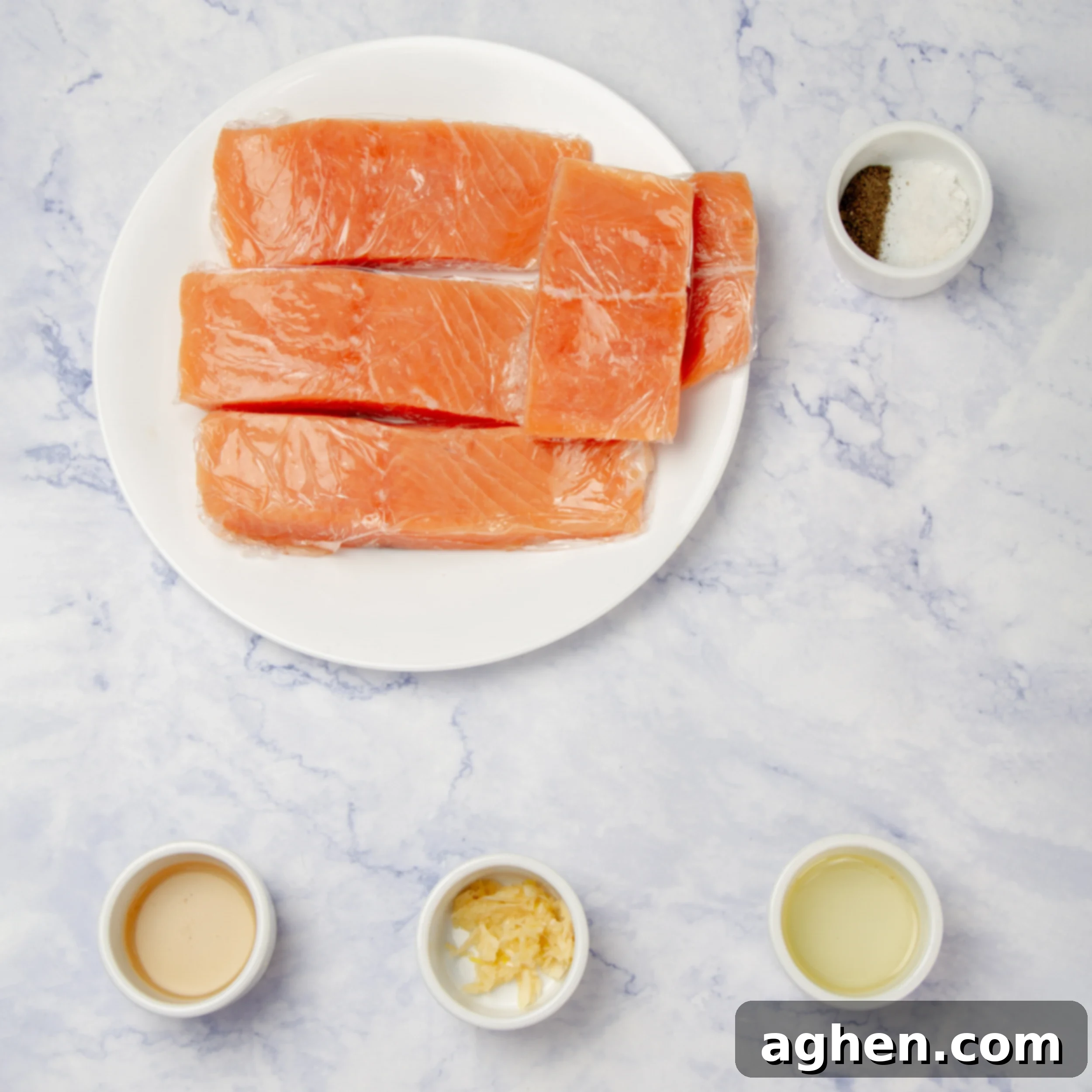 Air Fryer Salmon Perfection 3 Air fryer salmon ingredients in separate dishes on a counter.