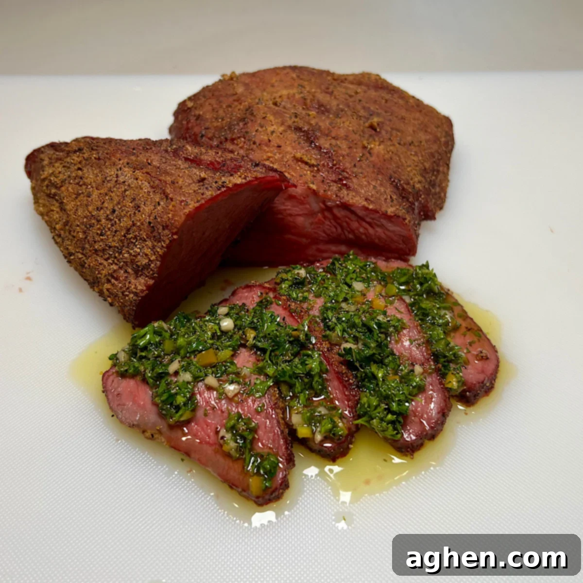 sliced smoked tri-tip with chimichurri sauce