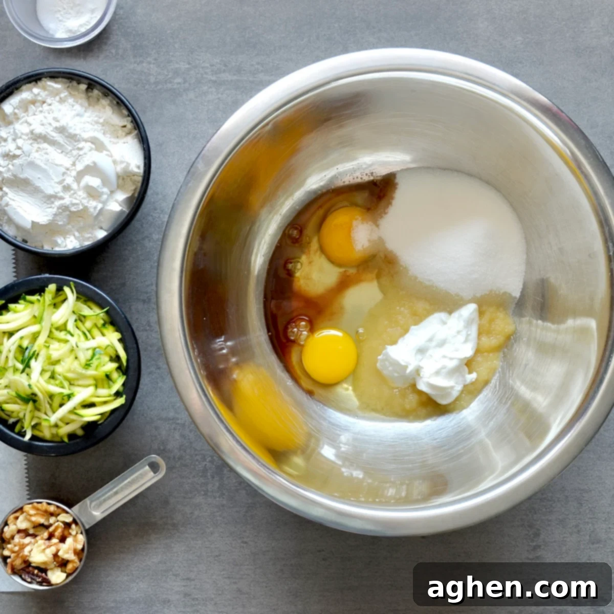 A Classic Weight Watchers Zucchini Walnut Bread 4 Eggs and other ingredients in a mixing bowl